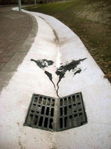 Graffiti of the planet being flushed down the drain